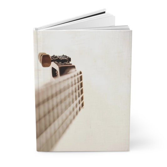 Music Guitar on White Journal